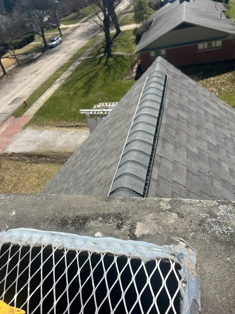 Ridge and hip shingles running along the peak of a completed roof